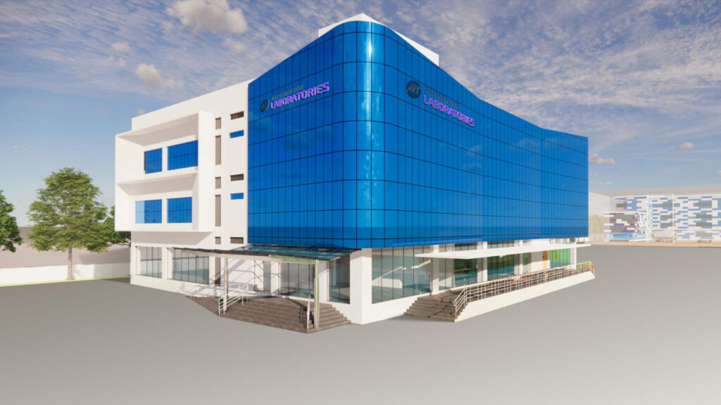 Tiefenbacher Group - A modern, multi-story building with white walls and large blue-tinted glass windows, labeled "Laboratories," reflects a family-owned pharmaceutical company focused on finished dosage forms. The entrance features stairs and a sleek glass canopy.