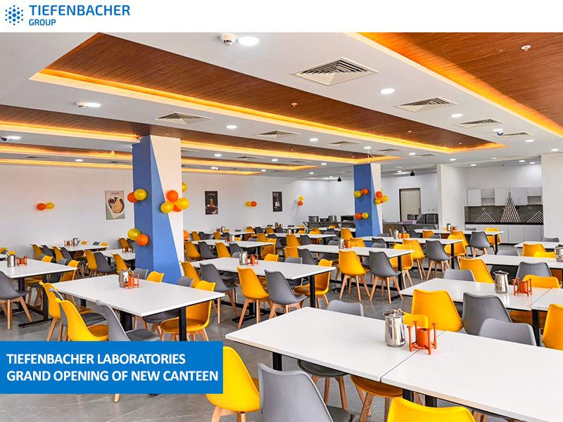 Tiefenbacher Group - A spacious, modern canteen with white tables and a mix of yellow and gray chairs. Colorful balloons decorate the walls. The bright, clean setting welcomes guests to Tiefenbacher Laboratories’ new canteen, a hub for pharmaceutical healthcare solutions.