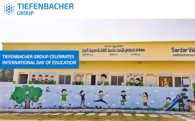 Tiefenbacher Group - A school building with colorful murals of children playing decorates the wall. A blue banner reads, “Tiefenbacher Group, a family-owned pharmaceutical company, celebrates International Day of Education.” The logo is at the top left.